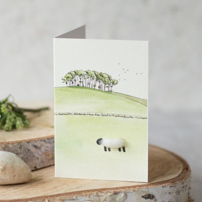 Mini Sheep beneath coppice on hill card