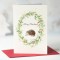 Hedgehog and floral wreath Christmas card