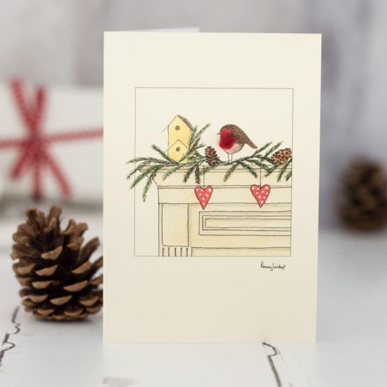 Robin on mantelpiece Christmas card