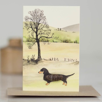 Mini Dachshund by tree and hillslope card Mini Dachshund by tree and hillslope card