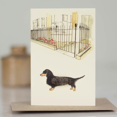 Mini Dachshund by city garden railings card Mini Dachshund by city garden railings card