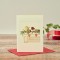 Robin on mantelpiece Christmas card