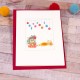 Ginger cat under baubles Christmas card