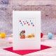 Ginger cat under baubles Christmas card