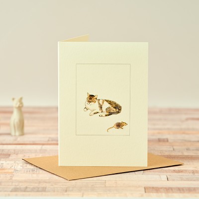 Cat lying down with mouse card