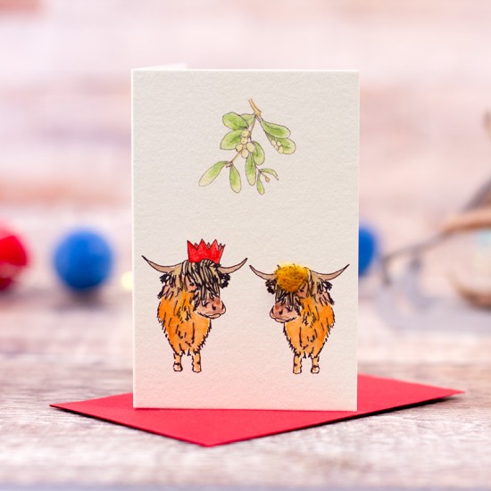 Mini Highland cows under the Mistletoe Christmas card