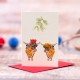 Mini Highland cows under the Mistletoe Christmas card